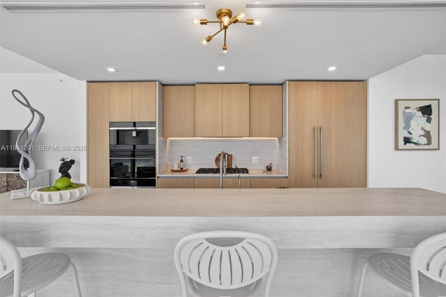 Chef-ready galley kitchen with Sub-Zero and Wolf appliances w/ wine cooler, plus integrated espresso/cappuccino system. Italian cabinetry and stone counters