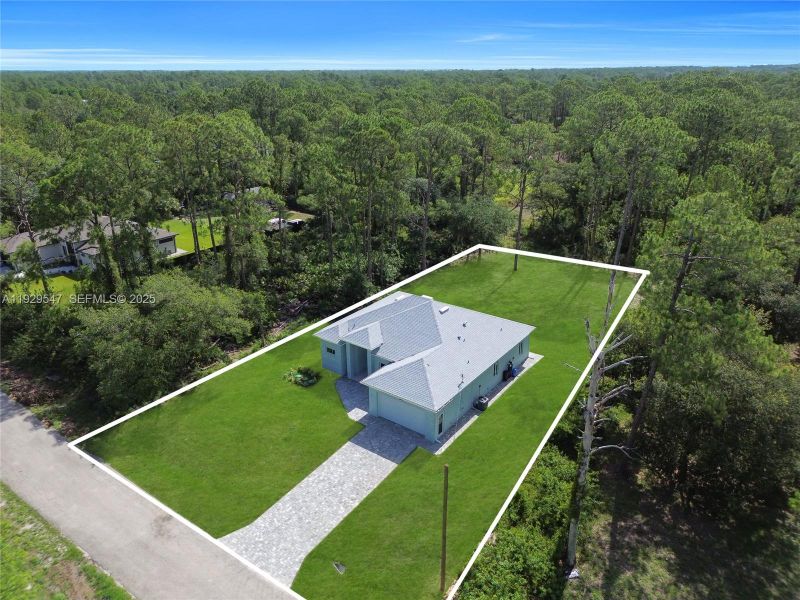 Front exterior of a new home in , Lehigh Acres, FL, highlighting curb appeal (Image 17). Front exterior of a new home in , Lehigh Acres, FL, highlighting curb appeal (Image 17).