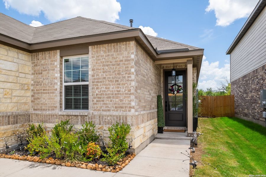 Exterior details and patio area of a home in Hightop Ridge, Converse (Image 4).