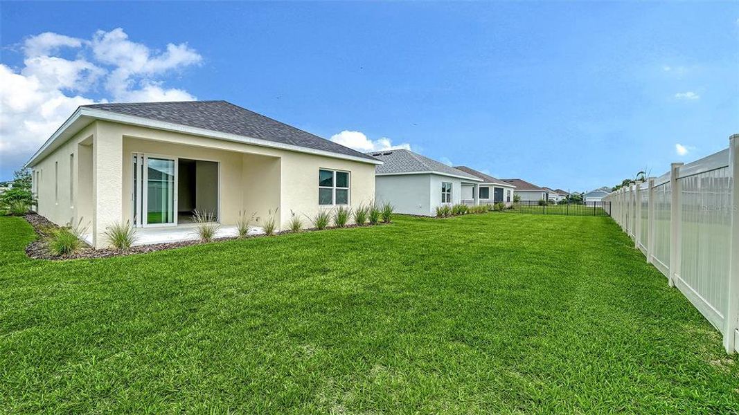 Exterior details and patio area of a home in Canoe Creek, Parrish (Image 25).