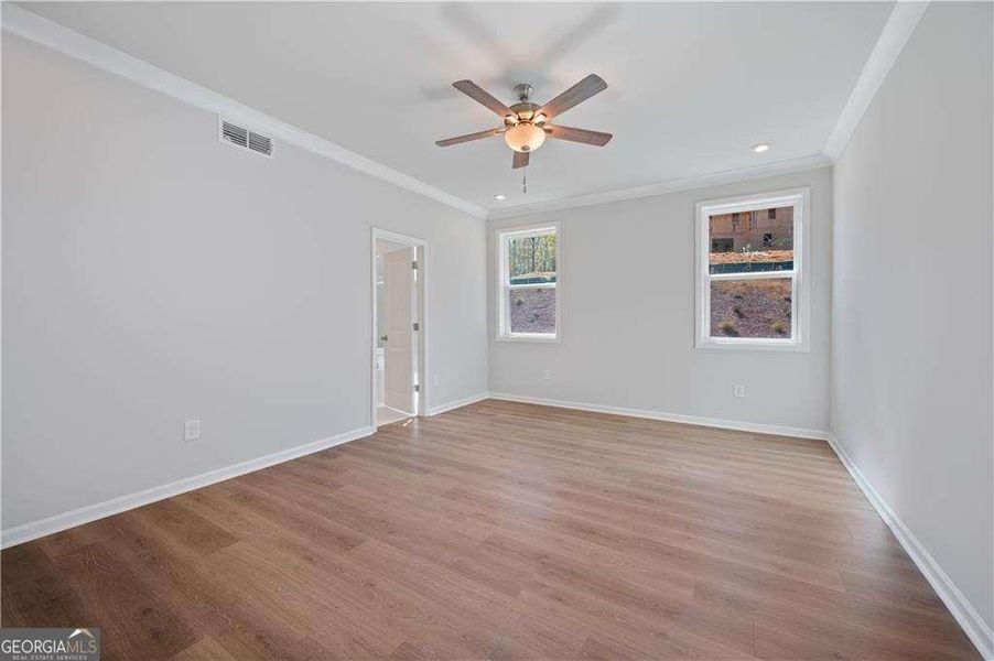 Spacious, unfurnished interior of a new home in The Paddocks at Doc Hughes, Buford (Image 38).