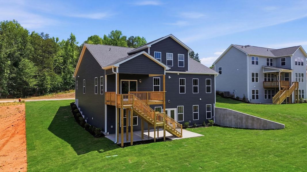 Highly functional rear covered porch adds memorable living space to this elegant home in the growing Woodruff, SC