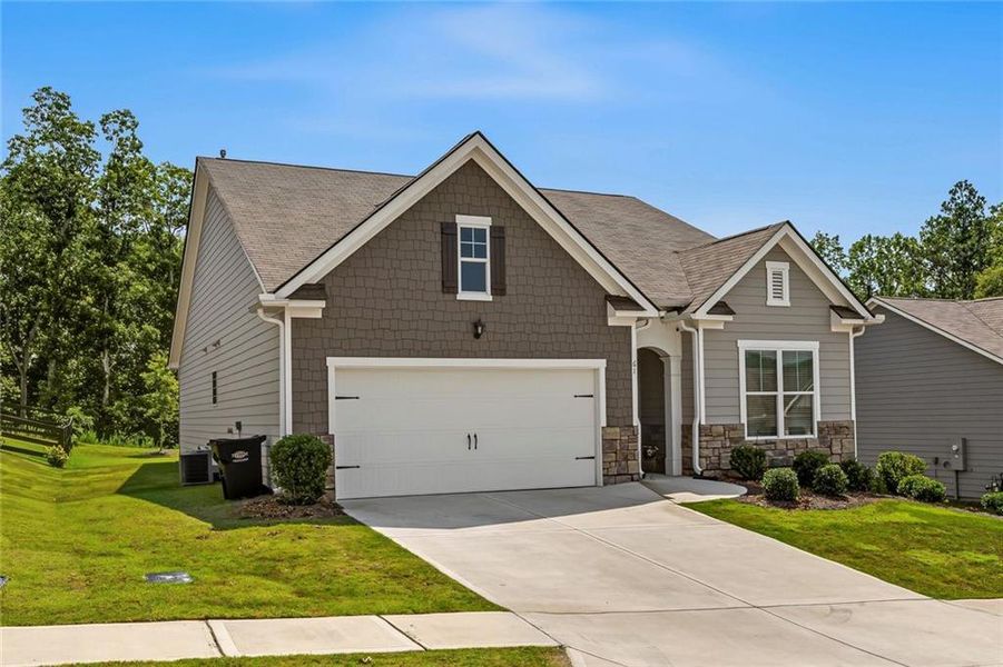 Front exterior of a new home in Lost Creek, Dallas, GA, highlighting curb appeal (Image 21). Front exterior of a new home in Lost Creek, Dallas, GA, highlighting curb appeal (Image 21).