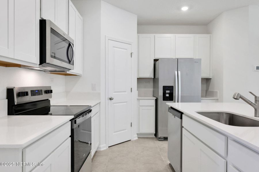 Furnished interior view inside a new home in Atlantis Pointe, Middleburg (Image 8).