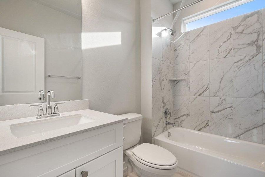 Full bathroom with washtub / shower combination and vanity