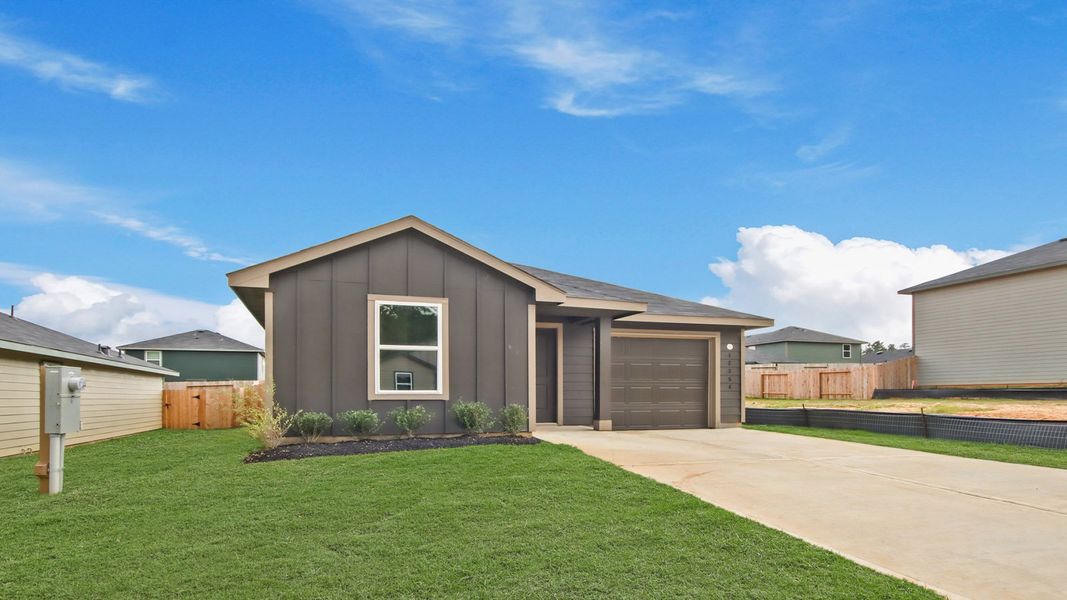 Front exterior of a new home in McCrorey Trails, Conroe, TX, highlighting curb appeal (Image 16).