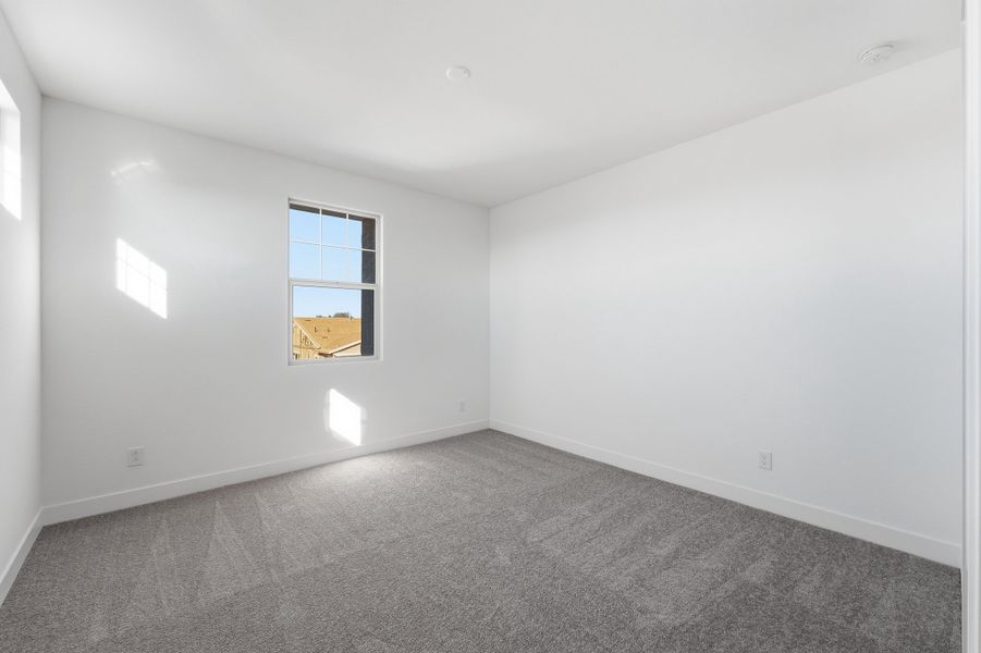 Spacious, unfurnished interior of a new home in Ellsworth Ranch, Queen Creek (Image 36).
