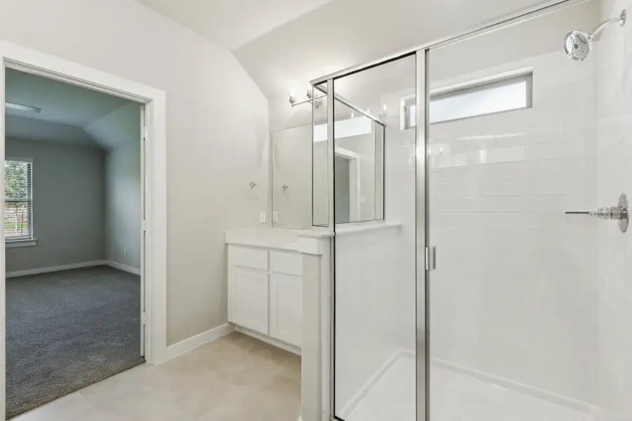 Primary Bathroom in the Heisman home plan by Trophy Signature Homes – REPRESENTATIVE PHOTO