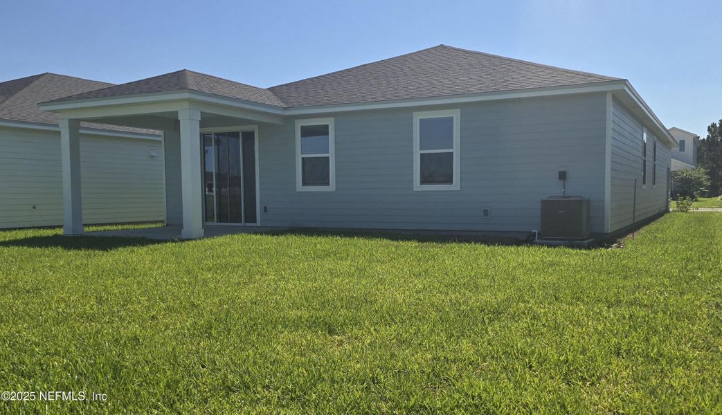 Front exterior of a new home in Lakes at Bella Lago - Signature Series, Green Cove Springs, FL, highlighting curb appeal (Image 14). Front exterior of a new home in Lakes at Bella Lago - Signature Series, Green Cove Springs, FL, highlighting curb appeal (Image 14).
