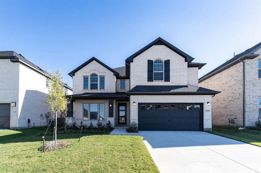 Front exterior of a new home in Green Meadows, Celina, TX, highlighting curb appeal (Image 1). Front exterior of a new home in Green Meadows, Celina, TX, highlighting curb appeal (Image 1).