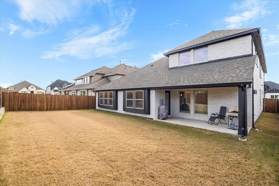 Exterior details and patio area of a home in , McLendon-Chisholm (Image 3).