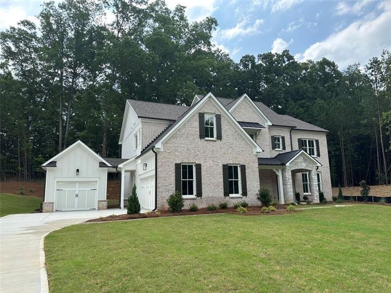Front exterior of a new home in Lanesborough, Marietta, GA, highlighting curb appeal (Image 1). Front exterior of a new home in Lanesborough, Marietta, GA, highlighting curb appeal (Image 1).