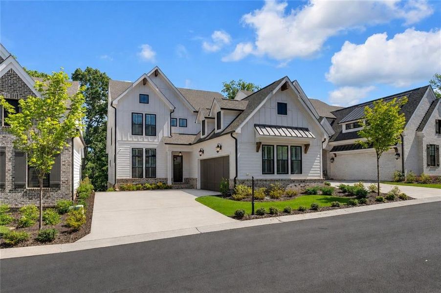 Front exterior of a new home in Waterside Single Family, Peachtree Corners, GA, highlighting curb appeal (Image 21). Front exterior of a new home in Waterside Single Family, Peachtree Corners, GA, highlighting curb appeal (Image 21).