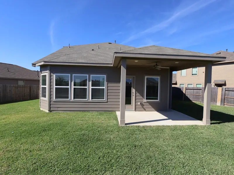Exterior details and patio area of a home in Pinewood at Grand Texas, New Caney (Image 4).