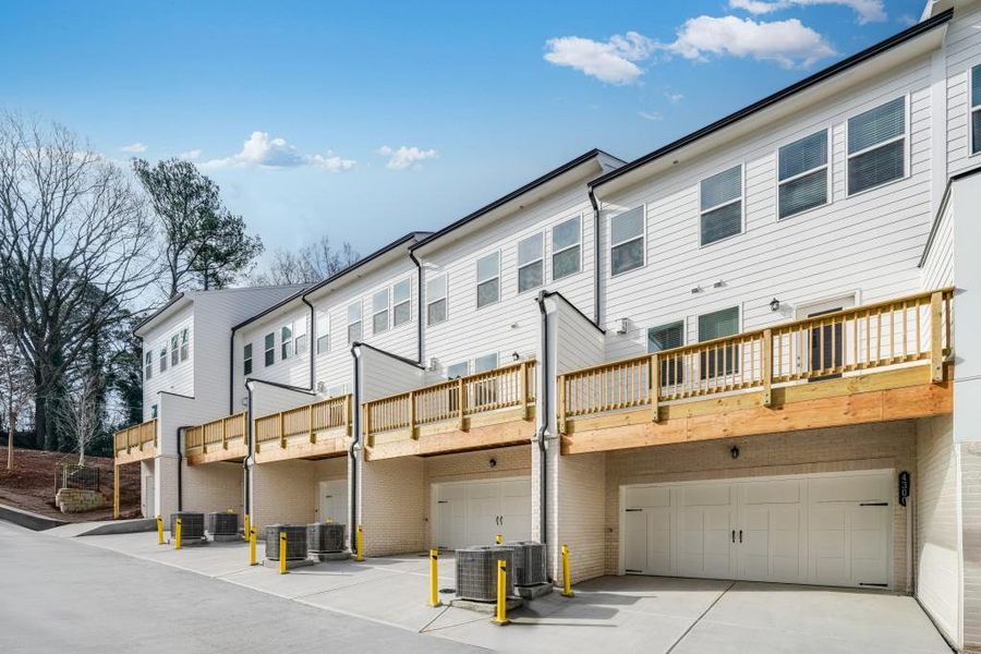 Exterior details and patio area of a home in Towns at Creekside, Doraville (Image 17).