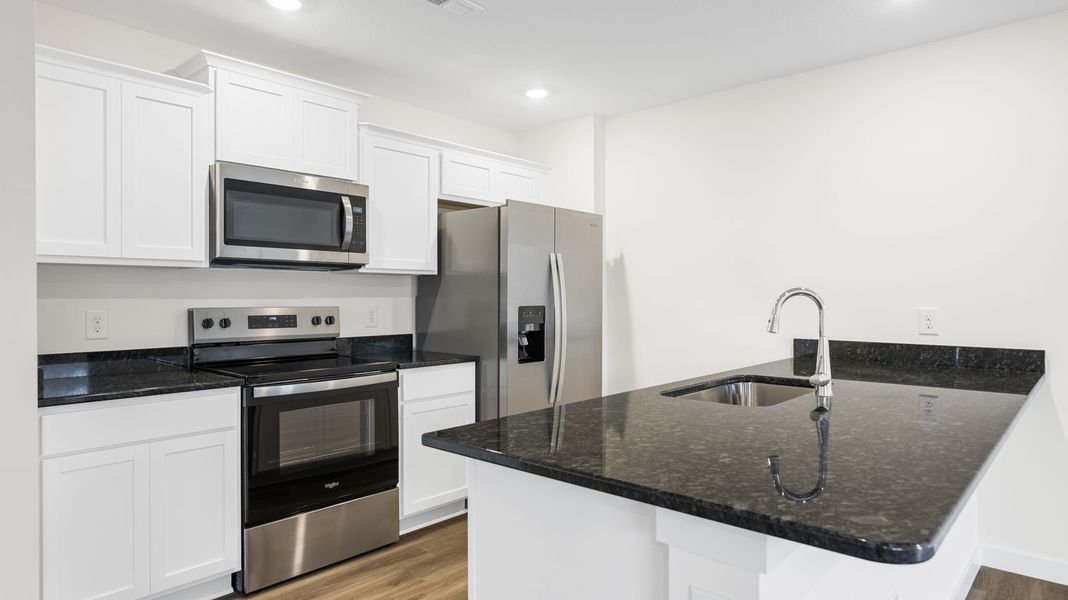 Representative furnished interior of a home built from the Freeport by D.R. Horton in Owensby Farms, Dayton (Image 7).