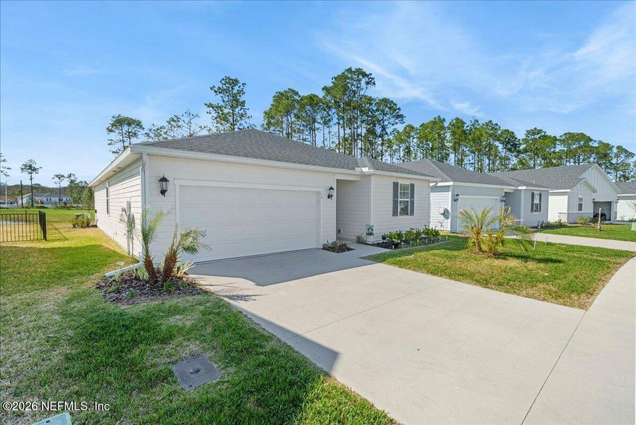 Front exterior of a new home in , Palm Coast, FL, highlighting curb appeal (Image 23).