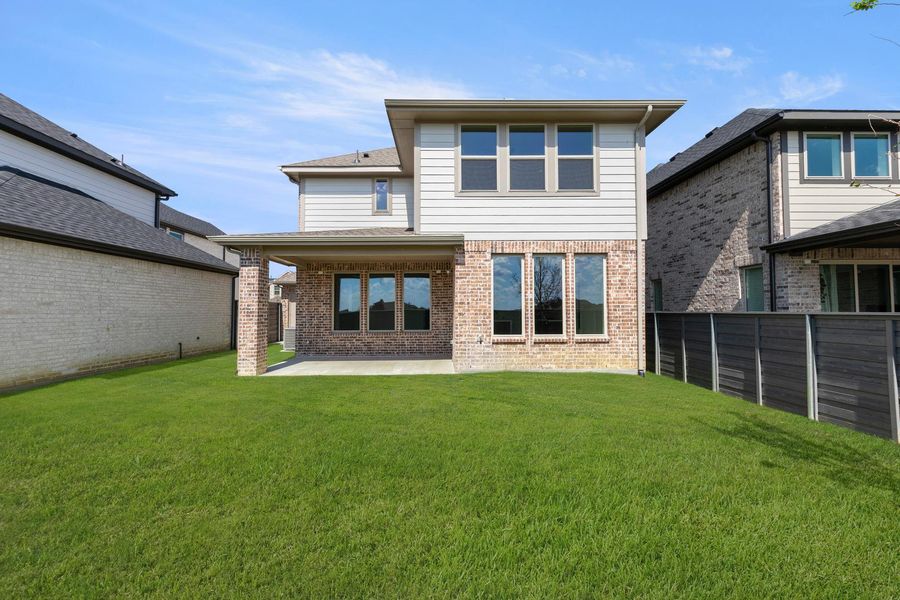 Exterior details and patio area of a home in Garden Collection at Union Park, Little Elm (Image 2).