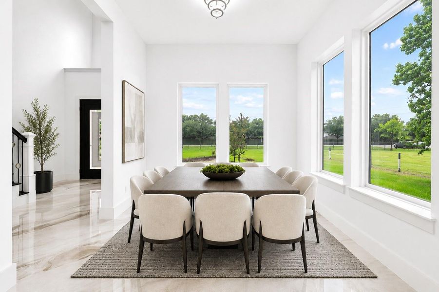 *Virtually Staged*Stunning formal dining space with expansive windows, sleek modern finishes, and ample room for entertaining in style.
