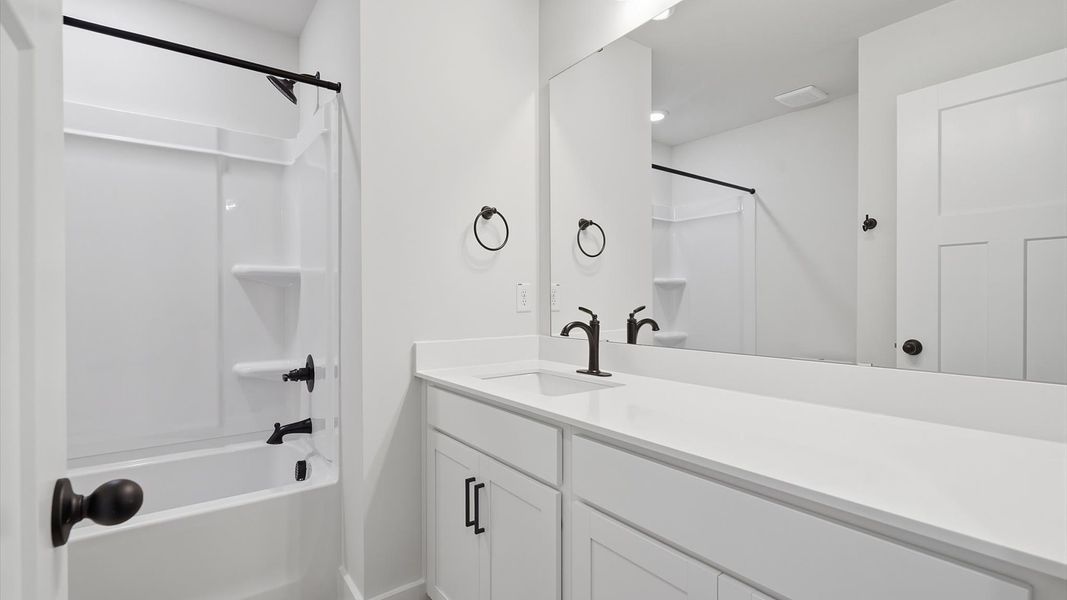 Vibrant and welcoming bathroom with elegant countertop space and polished details Vibrant and welcoming bathroom with elegant countertop space and polished details