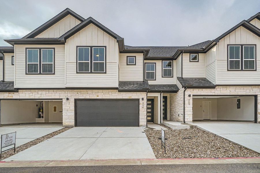 Front exterior of a new home in Townhomes at Gattis, Round Rock, TX, highlighting curb appeal (Image 2).