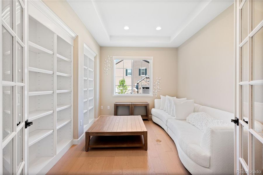 Library off of the Foyer with custom built in's, in floor electrical and seating area.