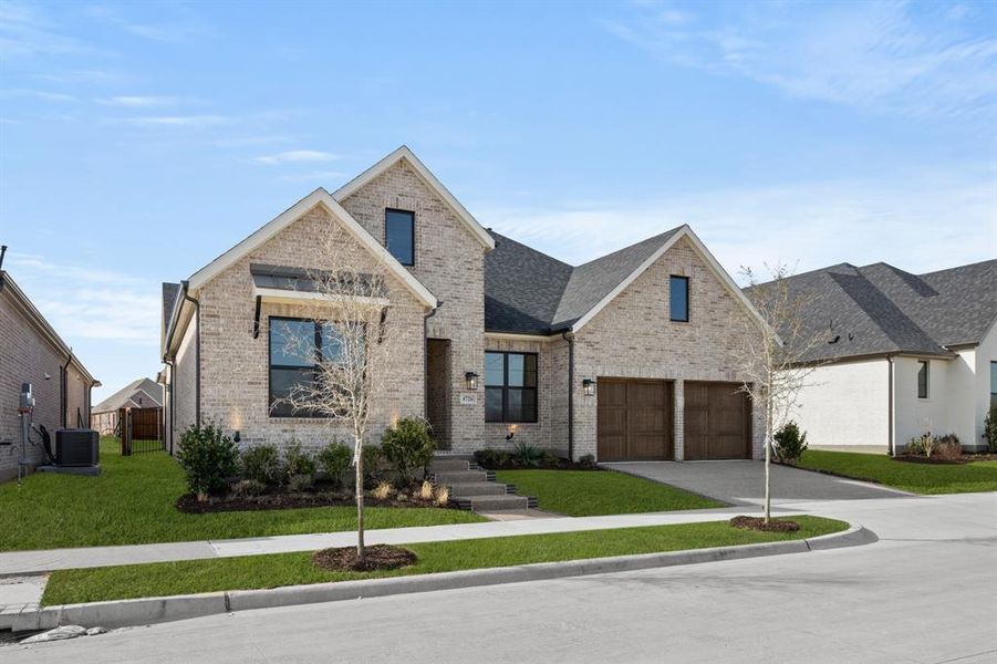 Front exterior of a new home in Viridian Elements, Arlington, TX, highlighting curb appeal (Image 20).