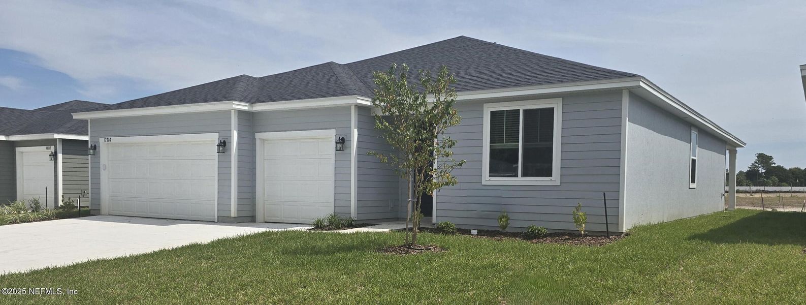 Front exterior of a new home in Azalea Creek, Jacksonville, FL, highlighting curb appeal (Image 1).