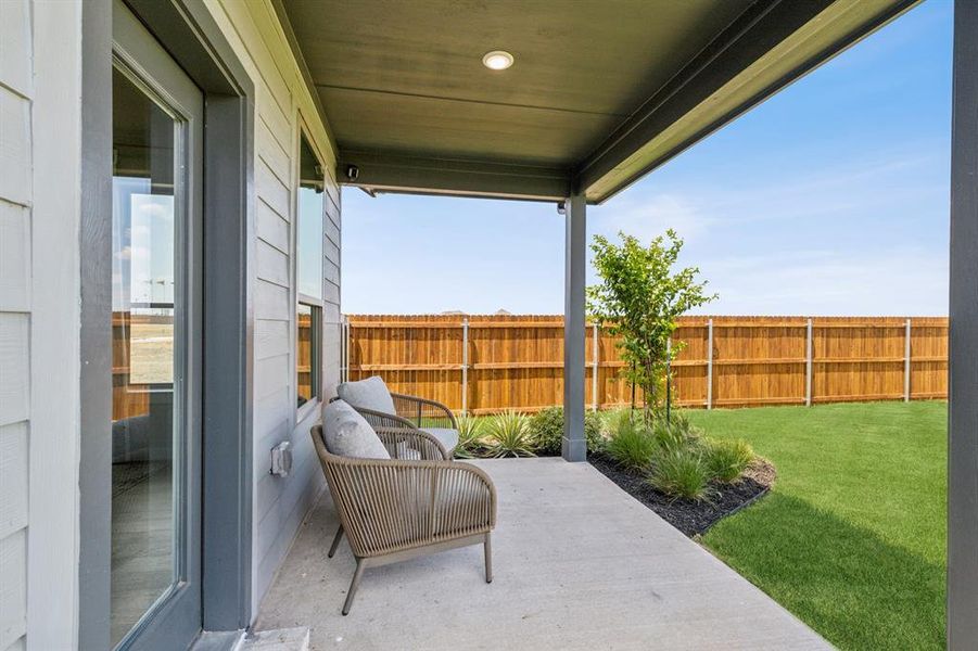 Covered Patio in the Winters home plan by Trophy Signature Homes  REPRESENTATIVE PHOTO
