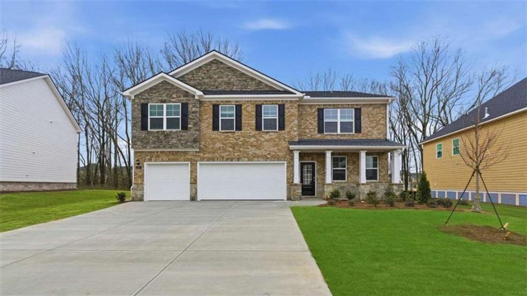 Front exterior of a new home in Independence, Loganville, GA, highlighting curb appeal (Image 2). Front exterior of a new home in Independence, Loganville, GA, highlighting curb appeal (Image 2).