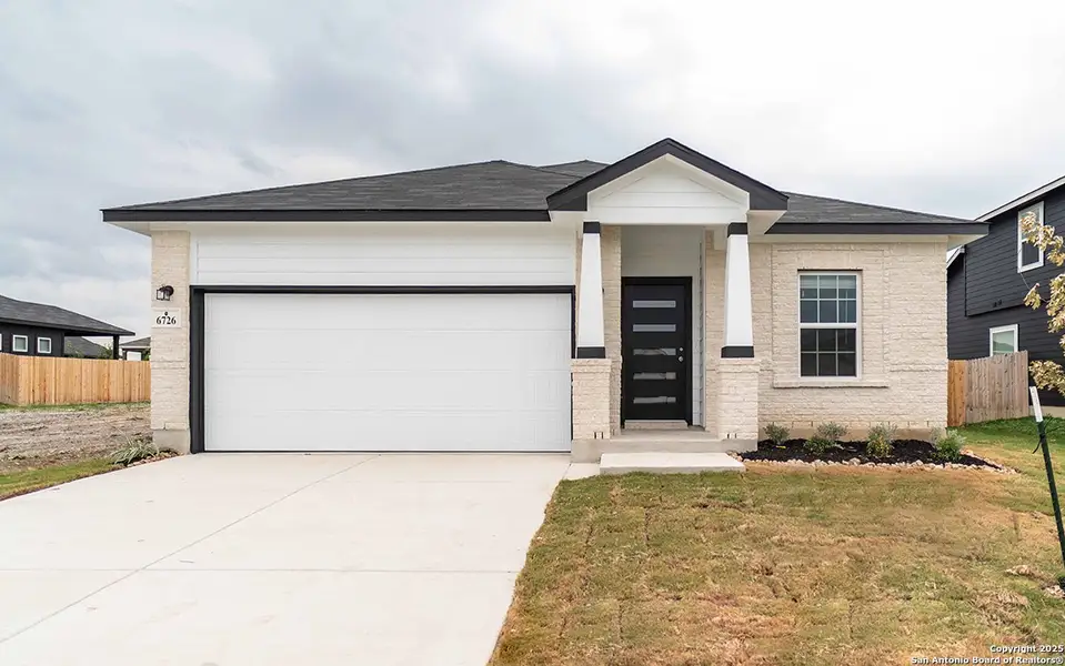 Front exterior of a new home in Morgan Meadows, San Antonio, TX, highlighting curb appeal (Image 1).