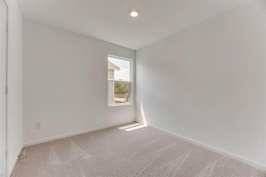 Unfurnished room featuring carpet flooring