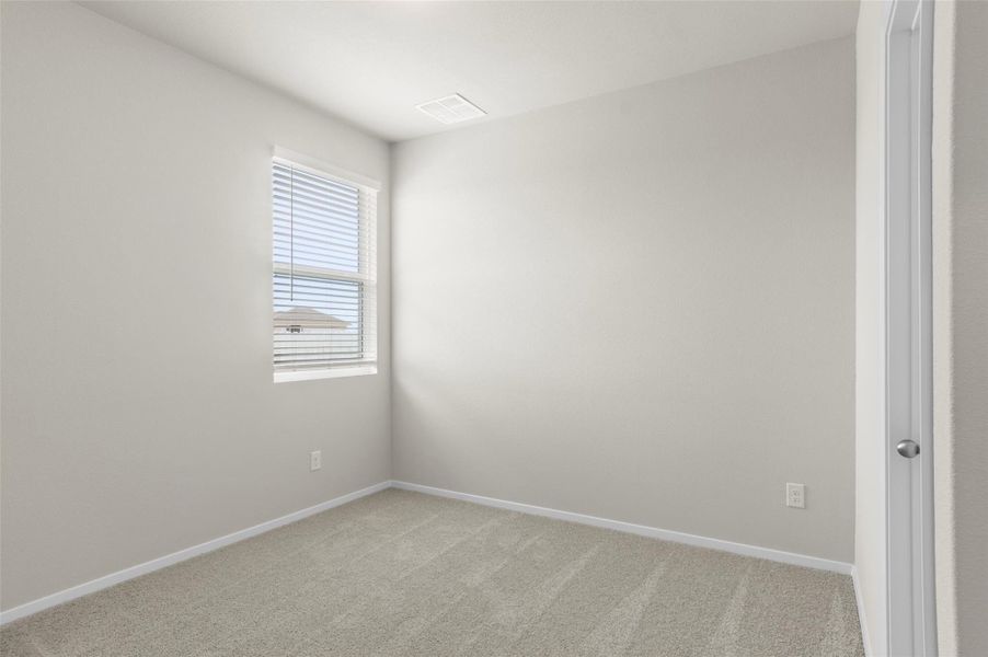 Unfurnished room featuring light colored carpet and baseboards Unfurnished room featuring light colored carpet and baseboards