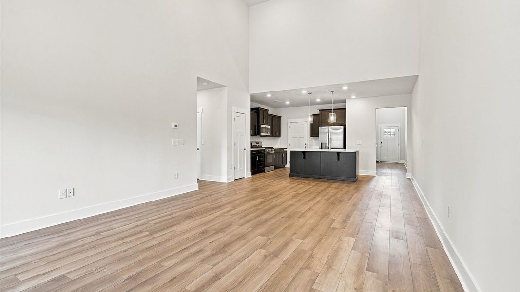 Hardwood flooring and high standards define this vibrant family room ideal for everyday living near Lake Hartwell