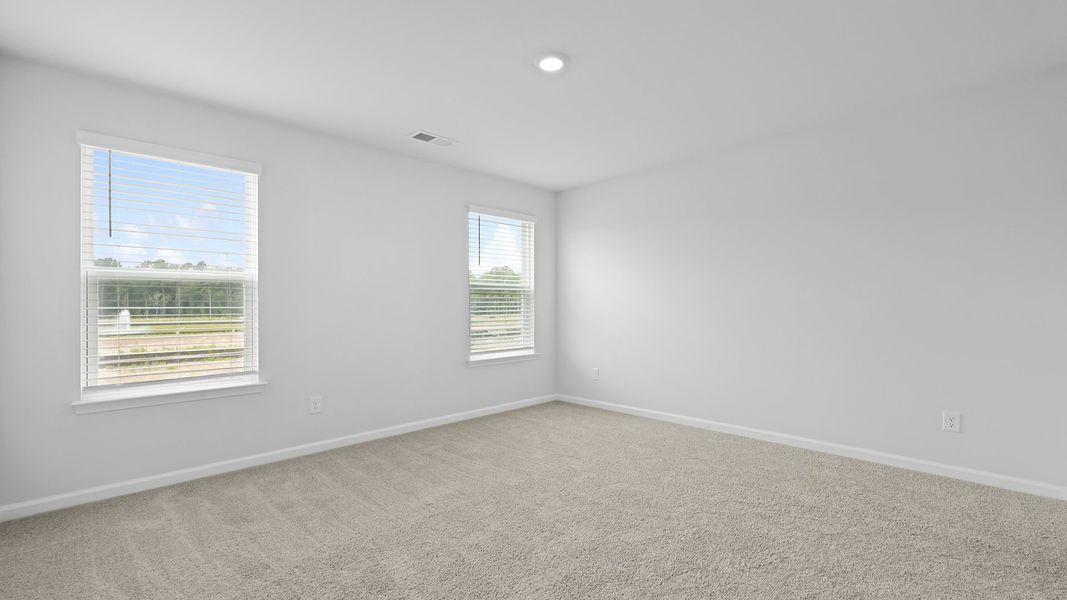 Spacious, unfurnished interior of a new home in Pine Hills Townhomes at Cane Bay, Summerville (Image 27).