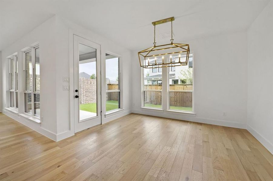 Light wood-finish flooring complements the white walls Light wood-finish flooring complements the white walls
