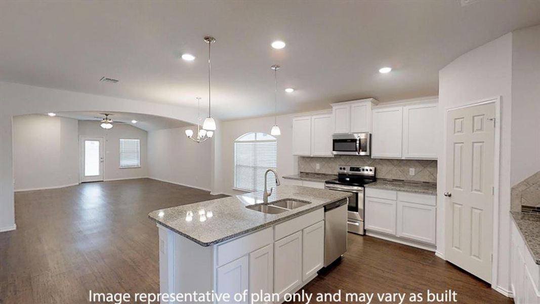 Kitchen featuring ceiling fan, a center island with sink, tasteful backsplash, light stone countertops, and recessed lighting Kitchen featuring ceiling fan, a center island with sink, tasteful backsplash, light stone countertops, and recessed lighting