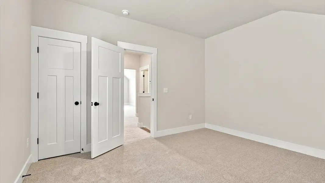 Memorable space offering plush carpet underfoot and a thoughtfully planned walk-in closet by DRB Homes