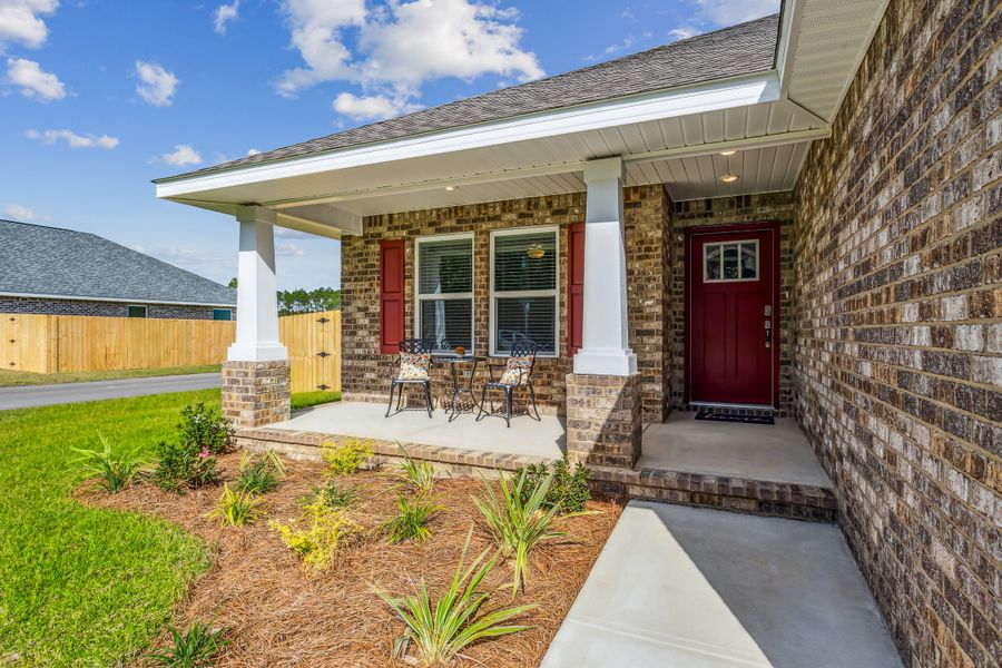 Representative exterior photo of a completed home built from the The Carlos by Herbst Homes in Doyle Hawkins Landing, Navarre, FL (Image 29).