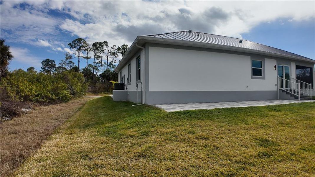 Exterior details and patio area of a home in , Port Charlotte (Image 3). Exterior details and patio area of a home in , Port Charlotte (Image 3).