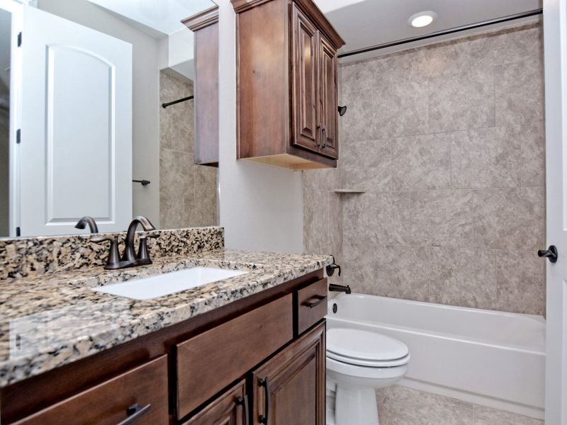 Representative furnished interior of a home built from the San Simeon II by Giddens Homes in Clearwater Ranch, Liberty Hill (Image 61).