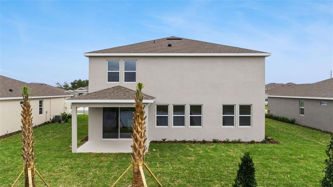 Exterior details and patio area of a home in Archers Mill, Ormond Beach (Image 2).