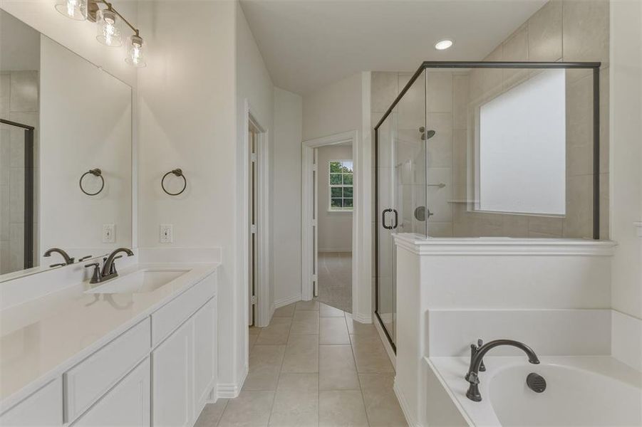 White double vanity with integrated sinks and dark bronze fixtures White double vanity with integrated sinks and dark bronze fixtures
