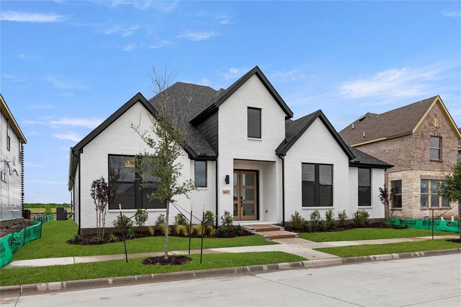 Front exterior of a new home in Talia, Mesquite, TX, highlighting curb appeal (Image 24). Front exterior of a new home in Talia, Mesquite, TX, highlighting curb appeal (Image 24).