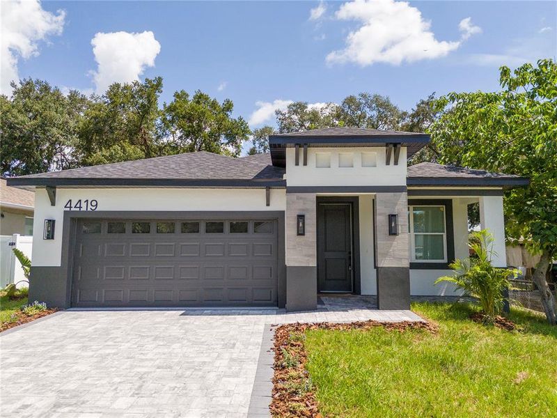 Front exterior of a new home in , Orlando, FL, highlighting curb appeal (Image 1). Front exterior of a new home in , Orlando, FL, highlighting curb appeal (Image 1).