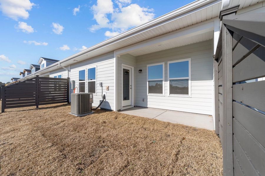 Exterior details and patio area of a home in Blue Heron Retreat, Little River (Image 16).