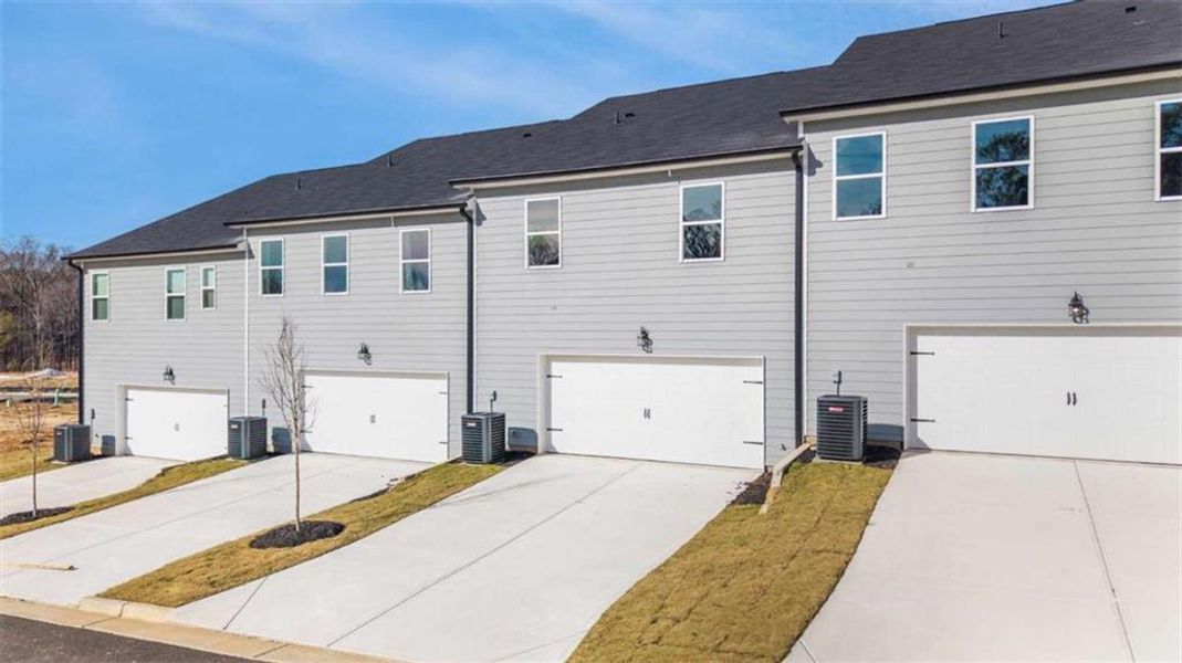 Front exterior of a new home in , Conyers, GA, highlighting curb appeal (Image 2). Front exterior of a new home in , Conyers, GA, highlighting curb appeal (Image 2).