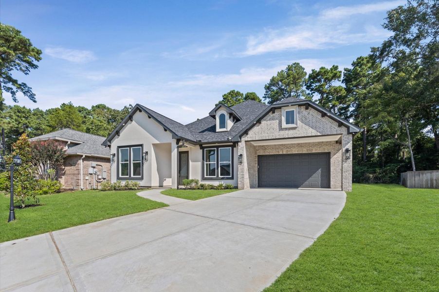 Front exterior of a new home in , Montgomery, TX, highlighting curb appeal (Image 26). Front exterior of a new home in , Montgomery, TX, highlighting curb appeal (Image 26).