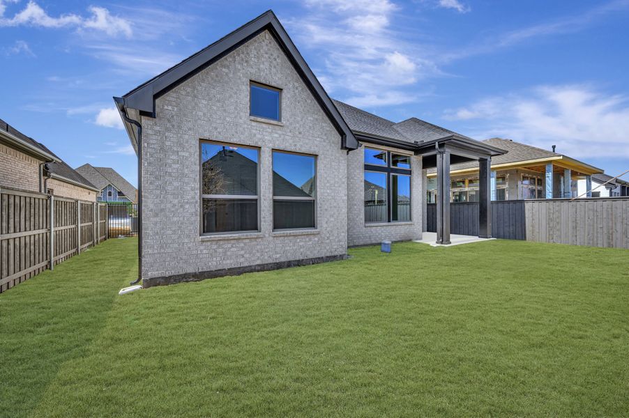 Exterior details and patio area of a home in Goodland – Classic Series, Grand Prairie (Image 3).