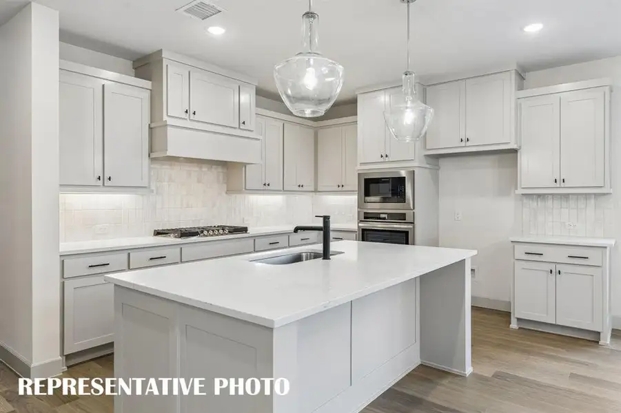 This outstanding kitchen offers ample space for all the chef's in the family to create! REPRESENTATIVE PHOTO This outstanding kitchen offers ample space for all the chef's in the family to create! REPRESENTATIVE PHOTO
